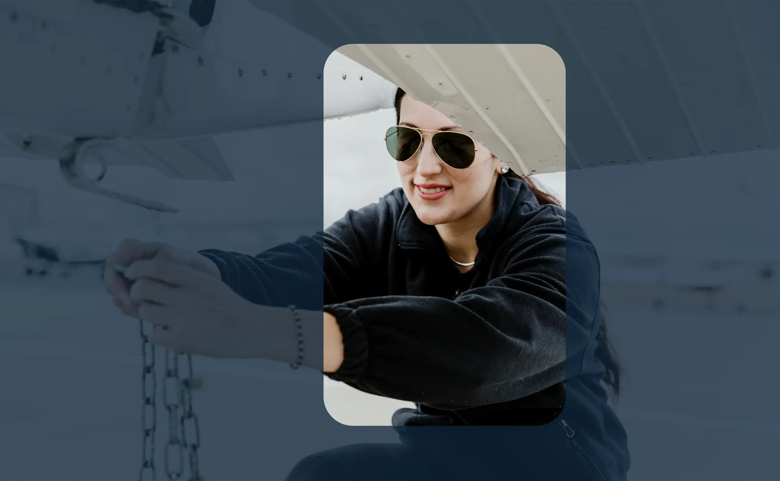 Woman in aviators and fleece securing aircraft tie-down. Crosswind Culture aviation tee lifestyle placeholder
